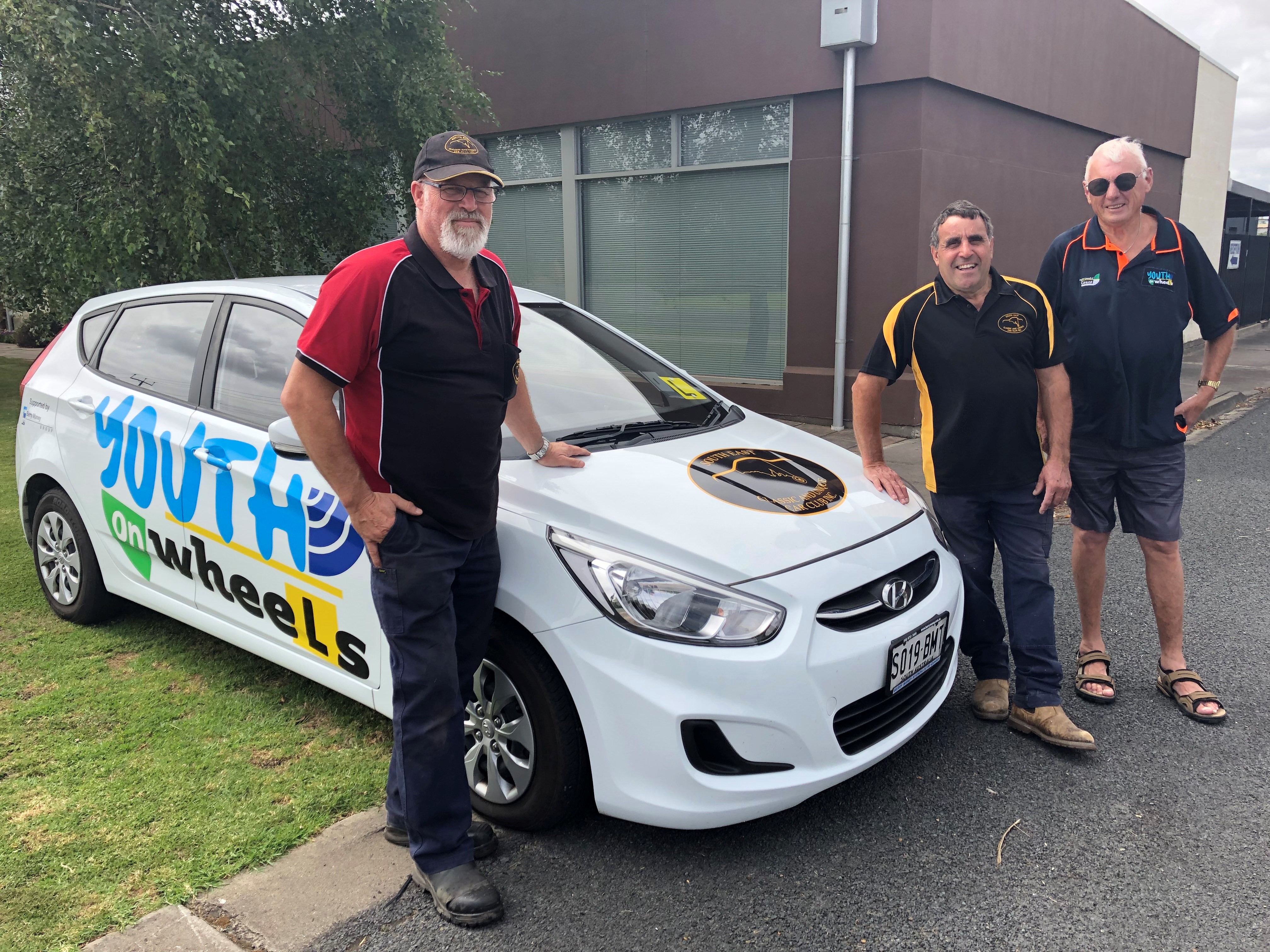 From left Mr Andrew Aldersey & Mr Frank Mittiga of the South East Classic & Unique Car Club Inc and Mr Jack Peacock - Council Volunteer for Youth on Wheels YOW Image