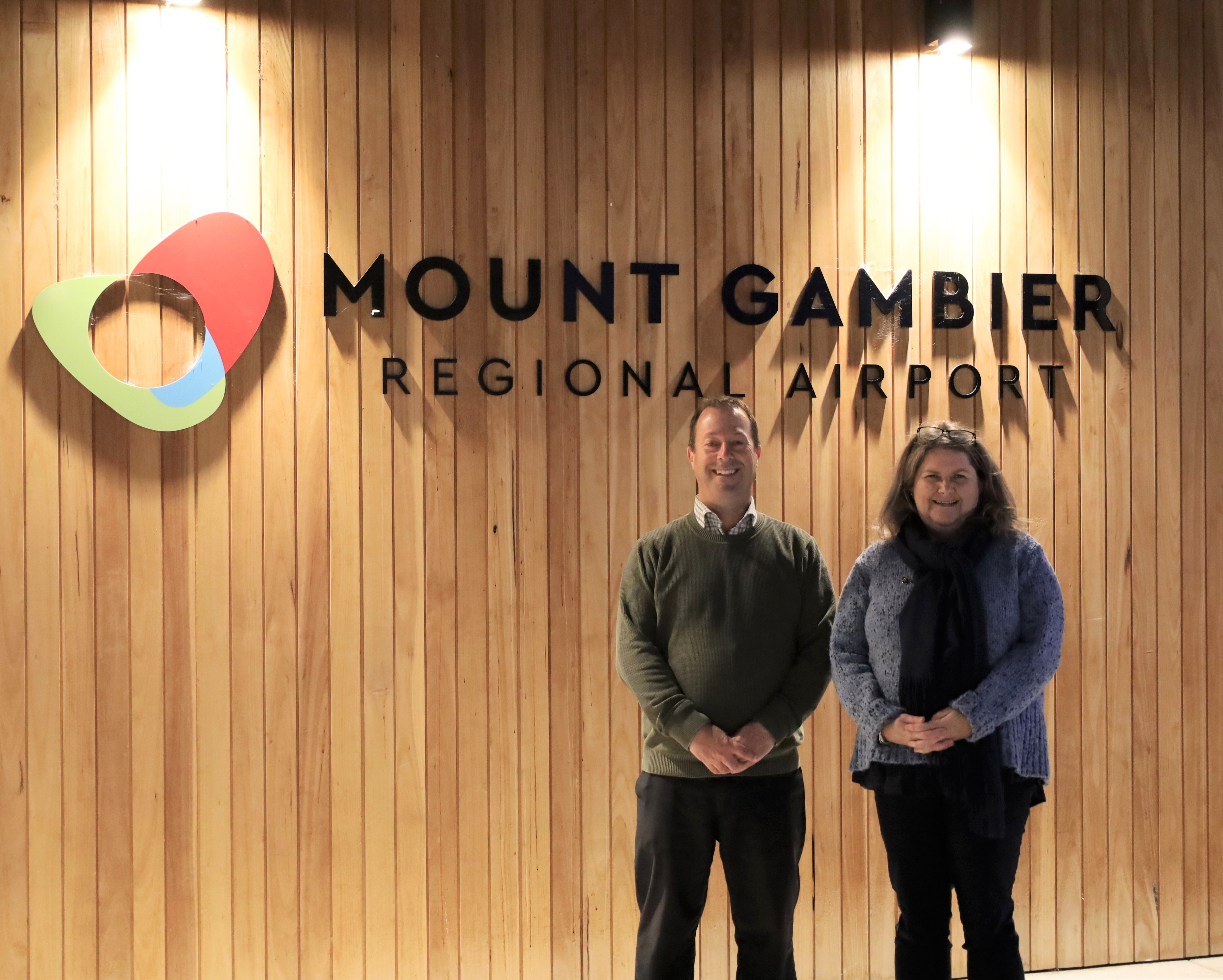 Mayor Kylie Boston and CEO Gary Button stand in front of the Mount Gambier Regional Airport front signage
